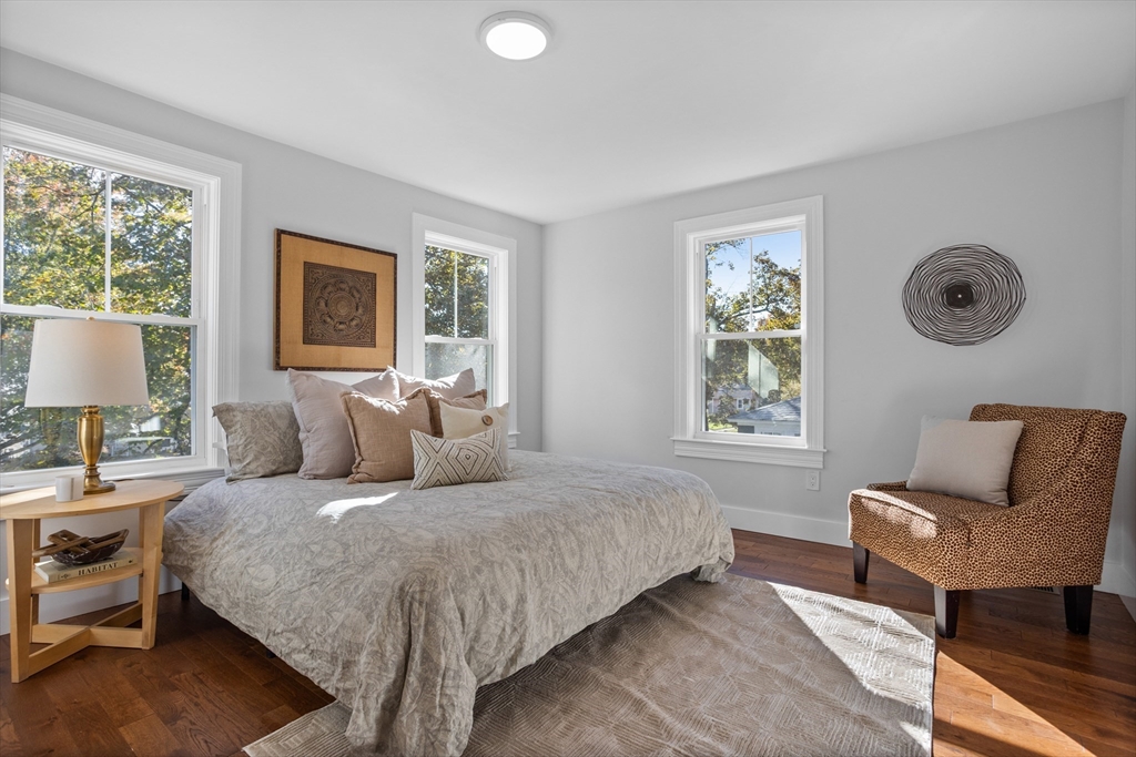 20 Tremont Street Maynard, MA 01754 - Photo 16 of 29 a bedroom with a bed and wooden floor