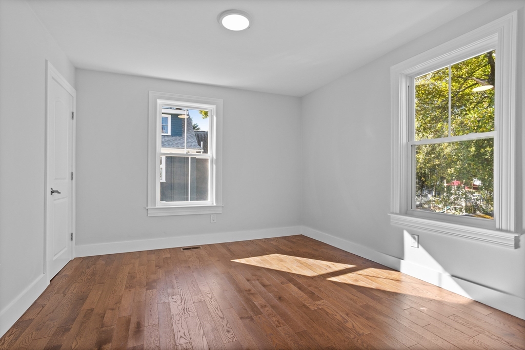 20 Tremont Street Maynard, MA 01754 - Photo 22 of 29 a view of empty room with wooden floor and fan