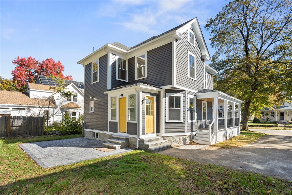 20 Tremont Street Maynard, MA 01754 - Photo 26 of 29 a front view of a house with a yard