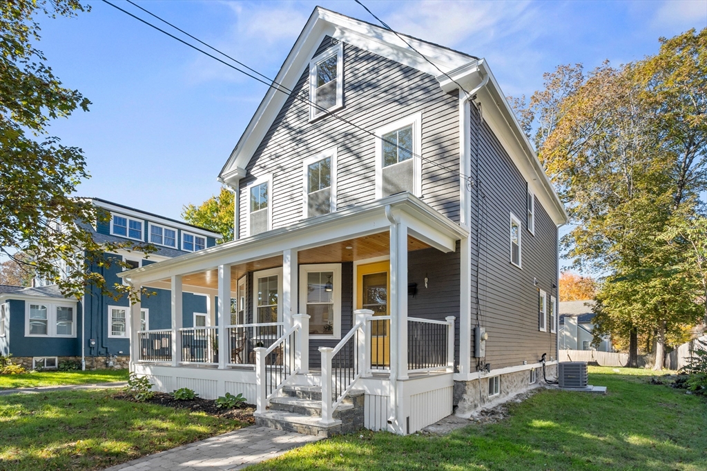 20 Tremont Street Maynard, MA 01754 - Photo 27 of 29 front view of a house with a yard