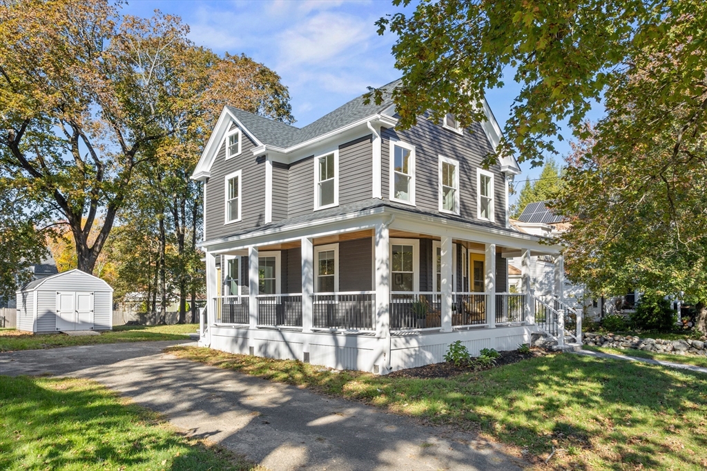 20 Tremont Street Maynard, MA 01754 - Photo 28 of 29 a front view of a house with a yard