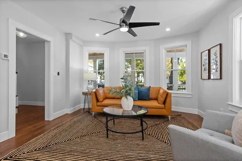 a living room with furniture and a window