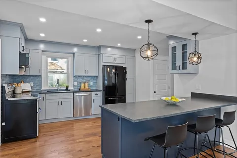 a kitchen with counter space cabinets and appliances