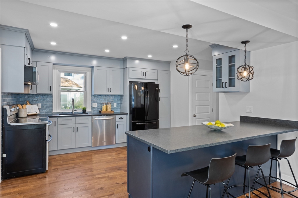 20 Tremont Street Maynard, MA 01754 - Photo 7 of 29 a kitchen with counter space cabinets and appliances
