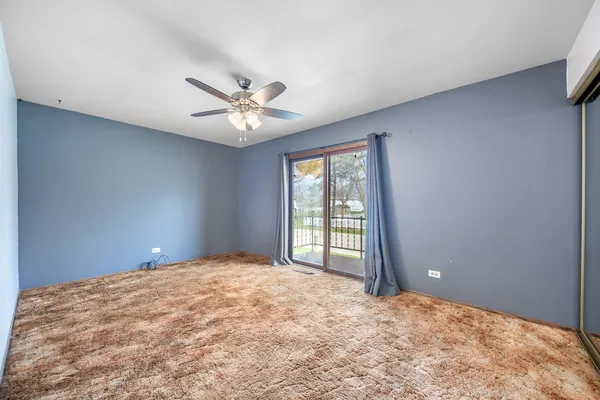 a bathroom with a sink a toilet a tub and shower