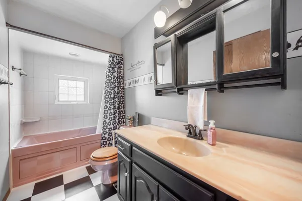 a view of room with window and ceiling fan