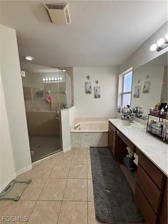 a bathroom with a sink a vanity and a mirror