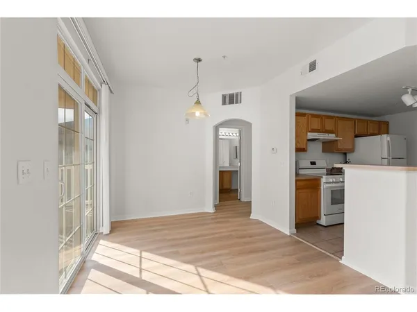 a bedroom with a bed and a mirror