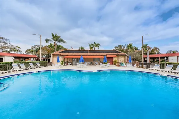 a view of pool and outdoor seating