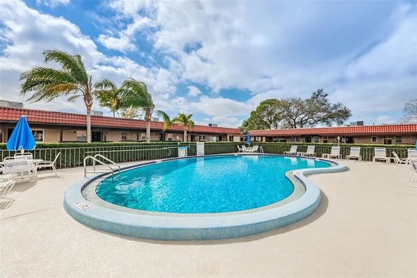 a view of a swimming pool with a patio