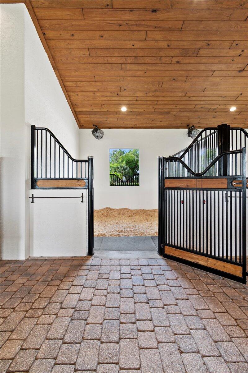 16575 Van Gogh Boulevard, Unit HORSE STALLS) Loxahatchee, FL 33470 - Photo 13 of 50 a view of entryway with wooden floor