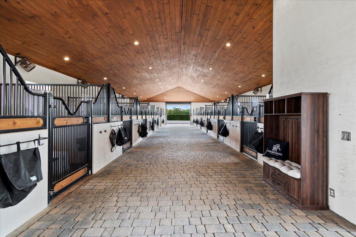 16575 Van Gogh Boulevard, Unit HORSE STALLS) Loxahatchee, FL 33470 - Photo 16 of 50 a view of a patio with table and chairs