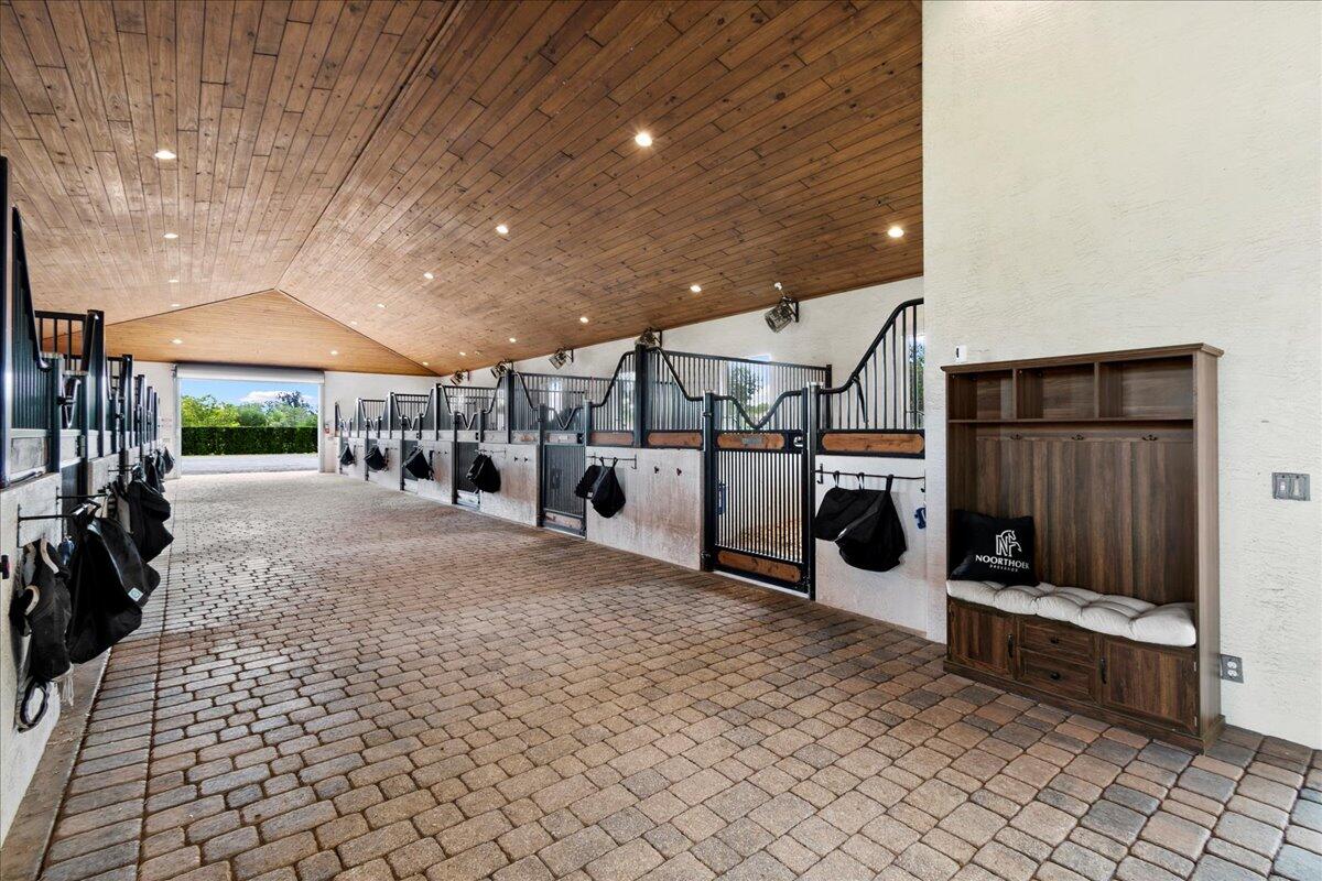 16575 Van Gogh Boulevard, Unit HORSE STALLS) Loxahatchee, FL 33470 - Photo 17 of 50 a view of a garage with wooden floor