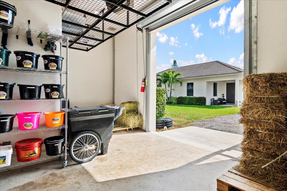 16575 Van Gogh Boulevard, Unit HORSE STALLS) Loxahatchee, FL 33470 - Photo 20 of 50 a car parked in front of a house