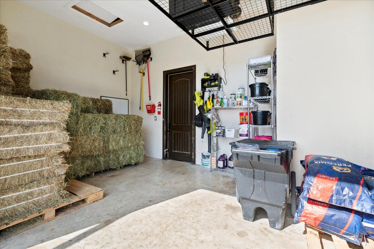 16575 Van Gogh Boulevard, Unit HORSE STALLS) Loxahatchee, FL 33470 - Photo 21 of 50 a living room with furniture and a couch