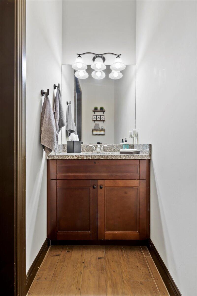 16575 Van Gogh Boulevard, Unit HORSE STALLS) Loxahatchee, FL 33470 - Photo 24 of 50 a bathroom with a granite countertop sink a mirror and vanity