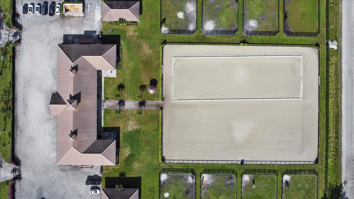 16575 Van Gogh Boulevard, Unit HORSE STALLS) Loxahatchee, FL 33470 - Photo 33 of 50 an aerial view of a house with a yard