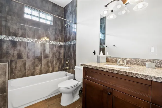 an aerial view of a residential houses with outdoor space