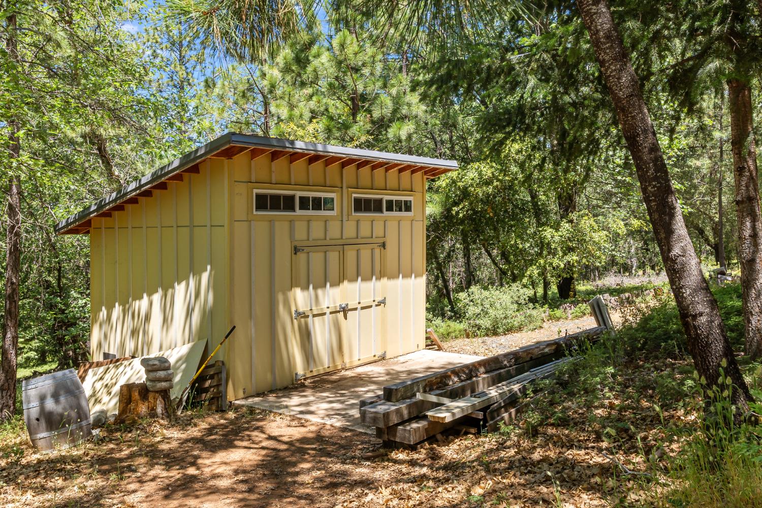 2640 Trail Gulch Road Placerville, CA 95667 - Photo 9 of 37 a blue house with trees in the background