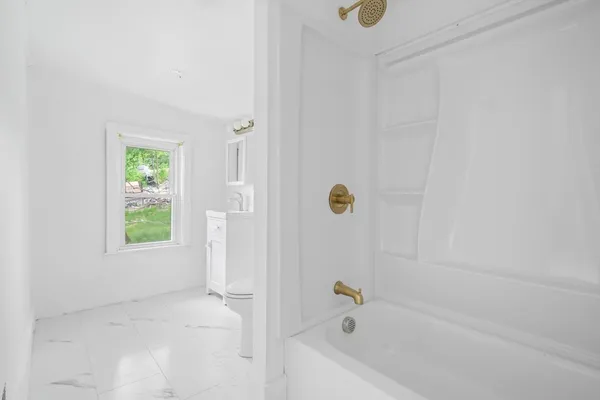 a bathroom with a bathtub