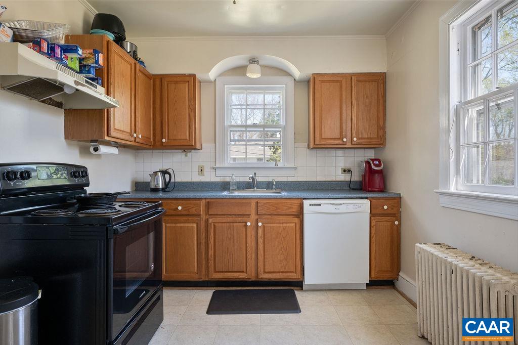 304 Alderman Road Charlottesville, VA 22903 - Photo 5 of 18 a kitchen with granite countertop a sink stainless steel appliances and cabinets