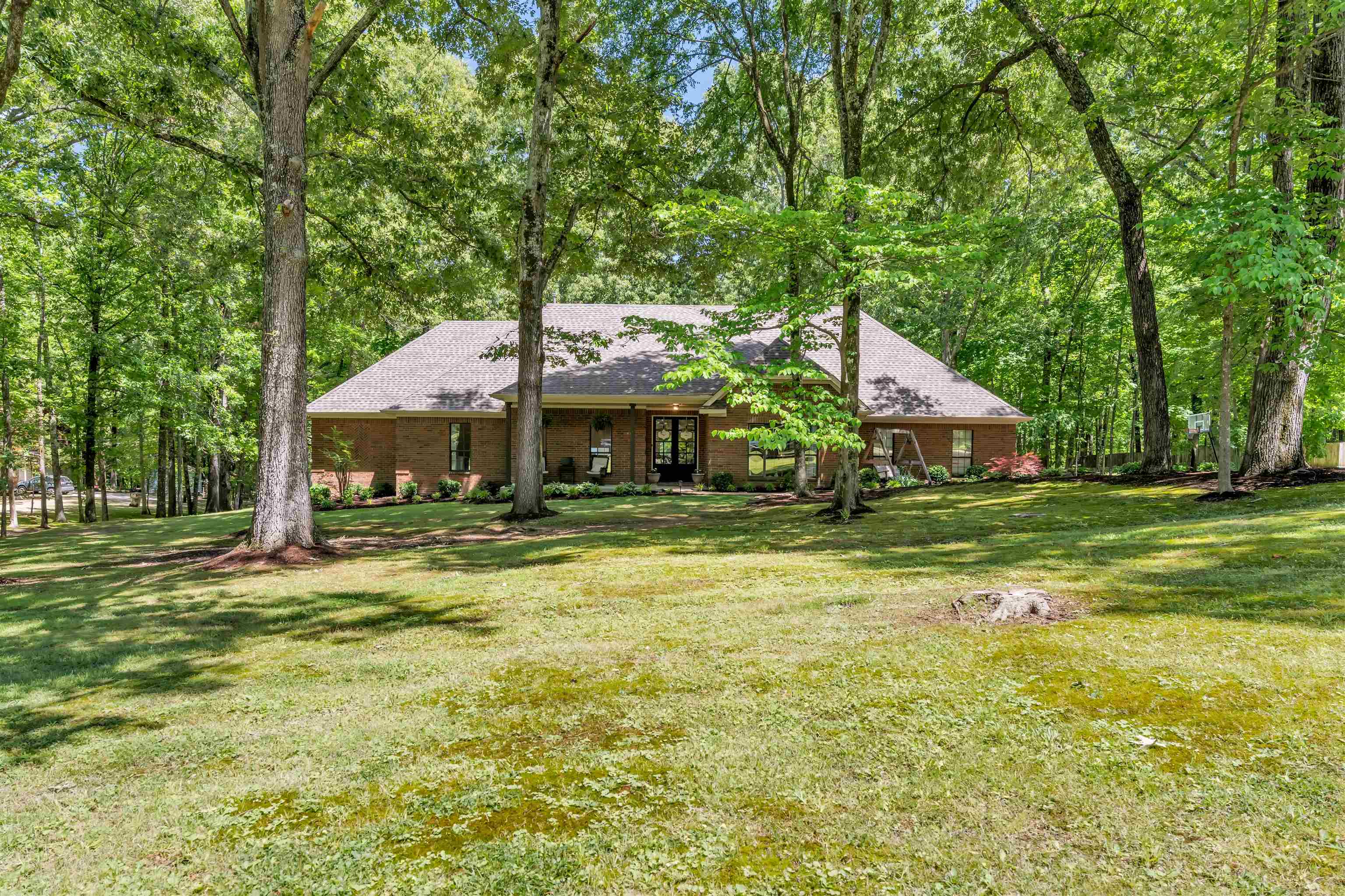 a front view of a house with a yard