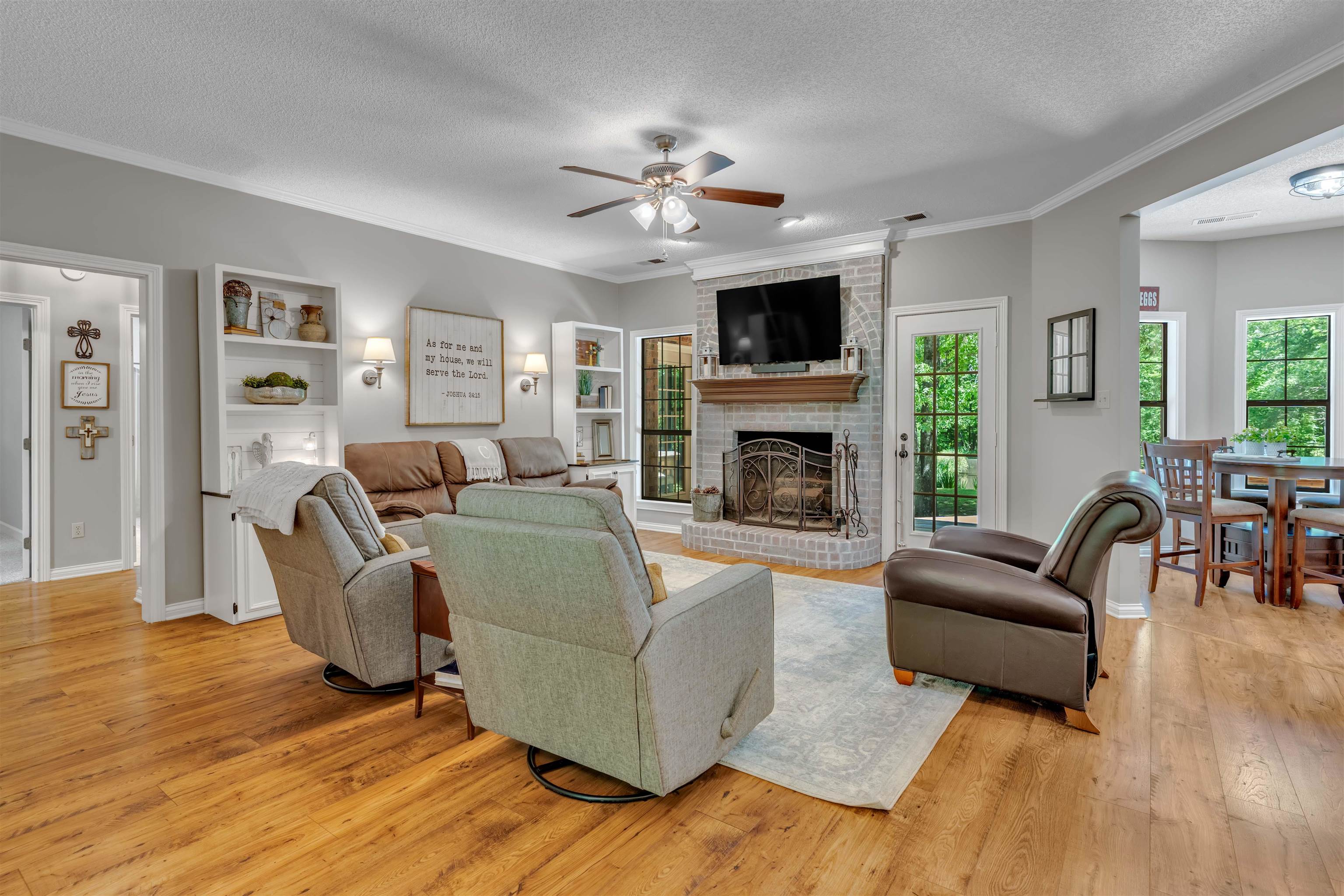 400 Great Oaks Road Eads, TN 38028 - Photo 12 of 40 a living room with furniture a fireplace and a flat screen tv