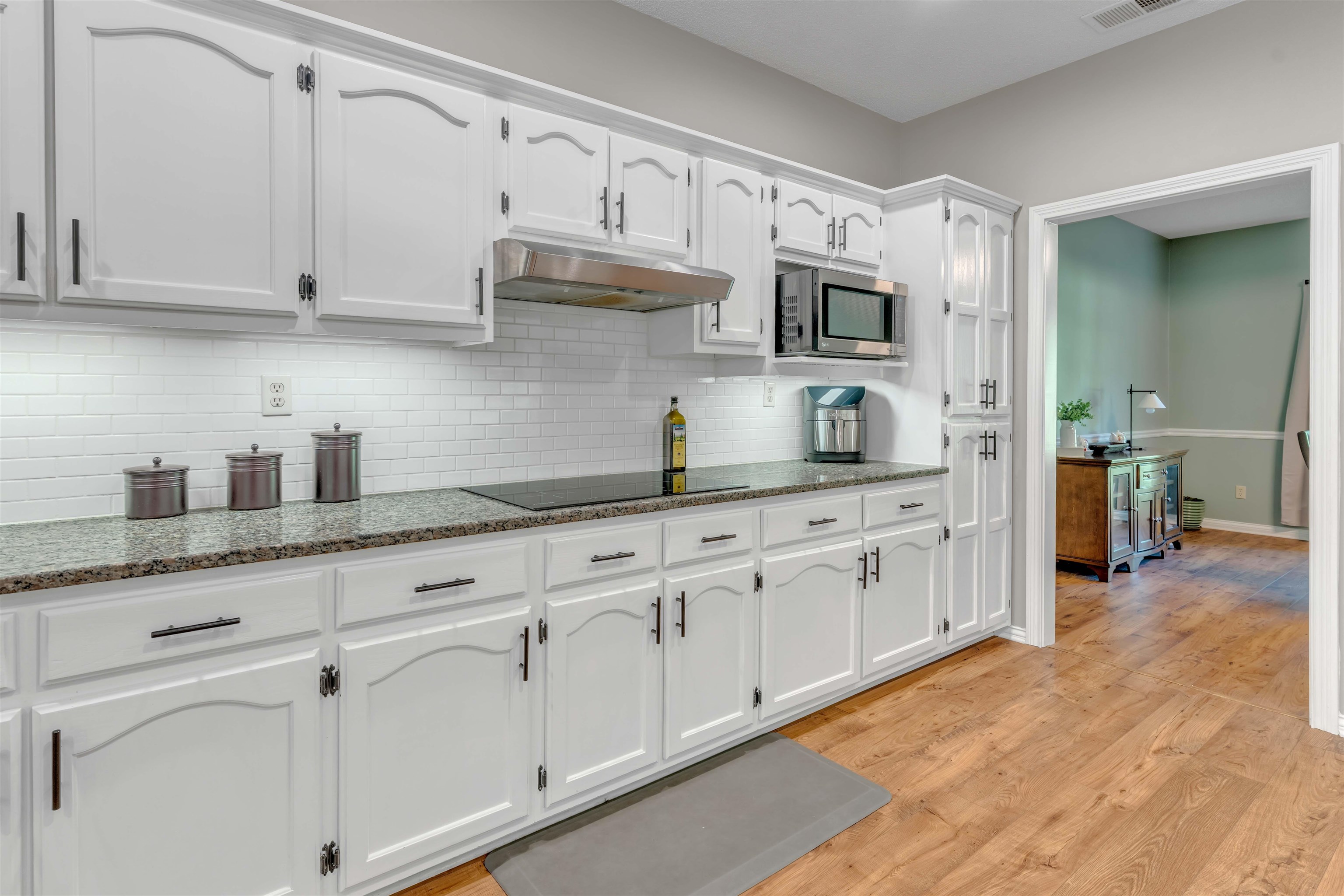 400 Great Oaks Road Eads, TN 38028 - Photo 16 of 40 a kitchen with stainless steel appliances granite countertop white cabinets and a sink