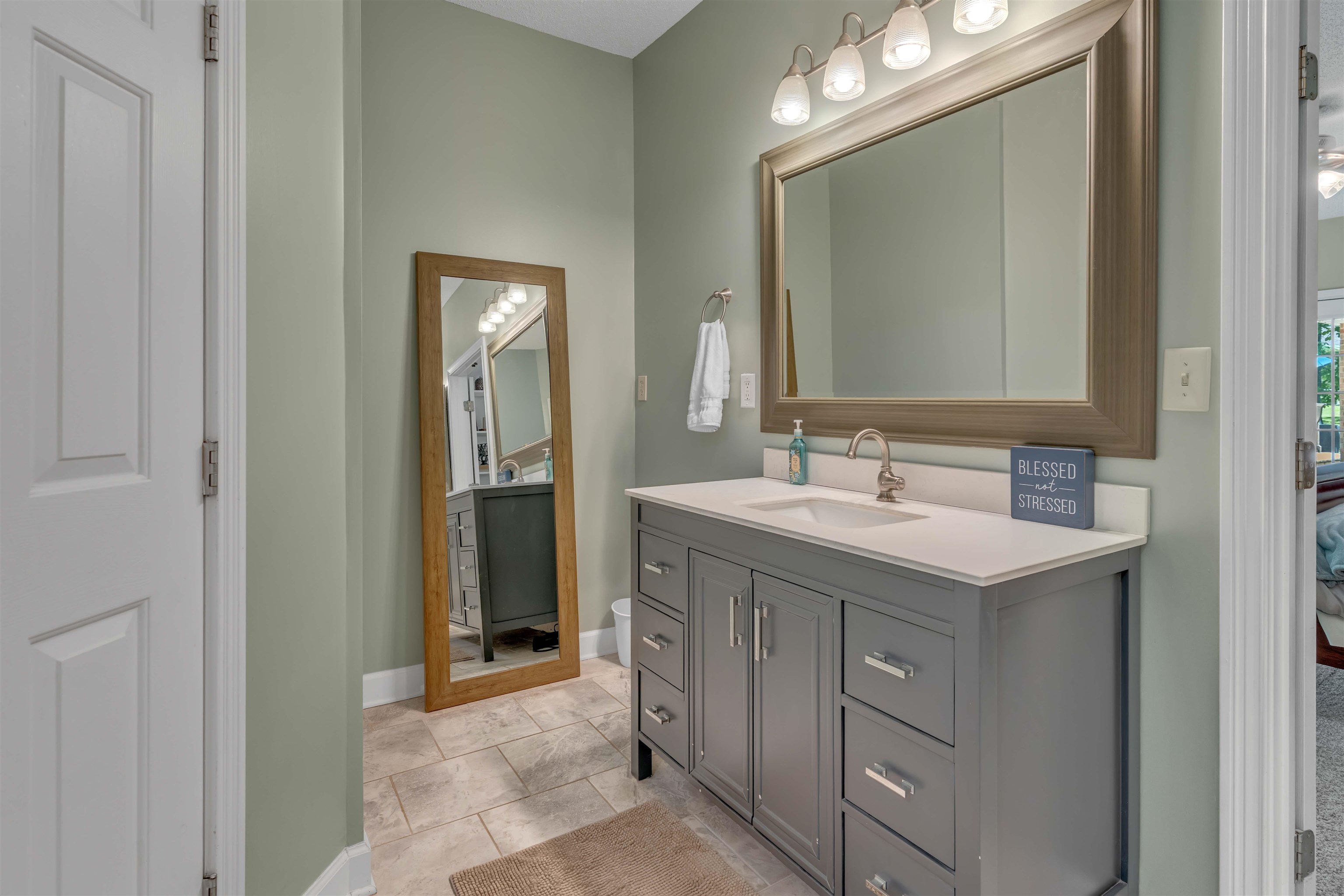 400 Great Oaks Road Eads, TN 38028 - Photo 21 of 40 a bathroom with a sink vanity and a mirror