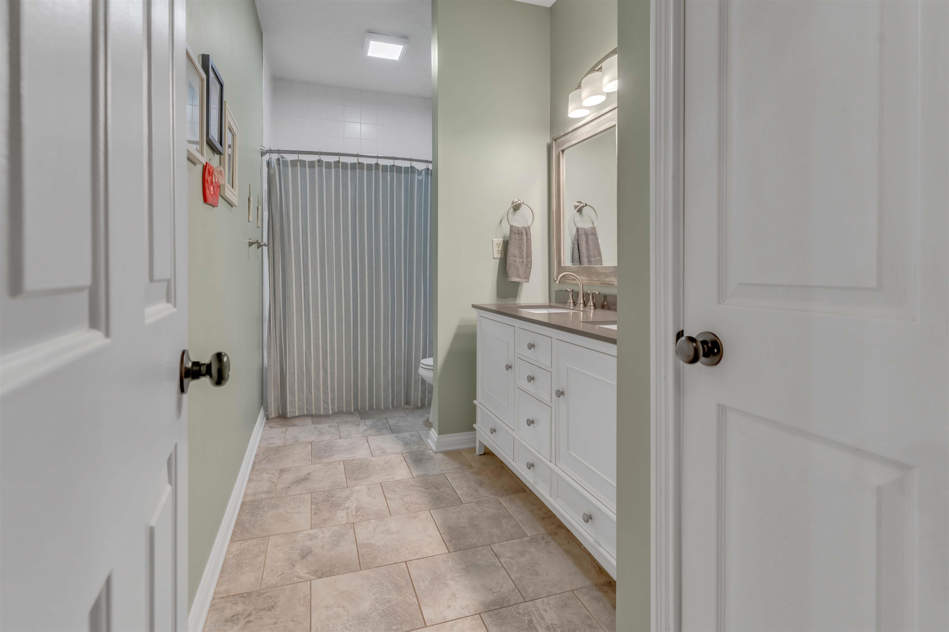 400 Great Oaks Road Eads, TN 38028 - Photo 26 of 40 a bathroom with a mirror and a shower