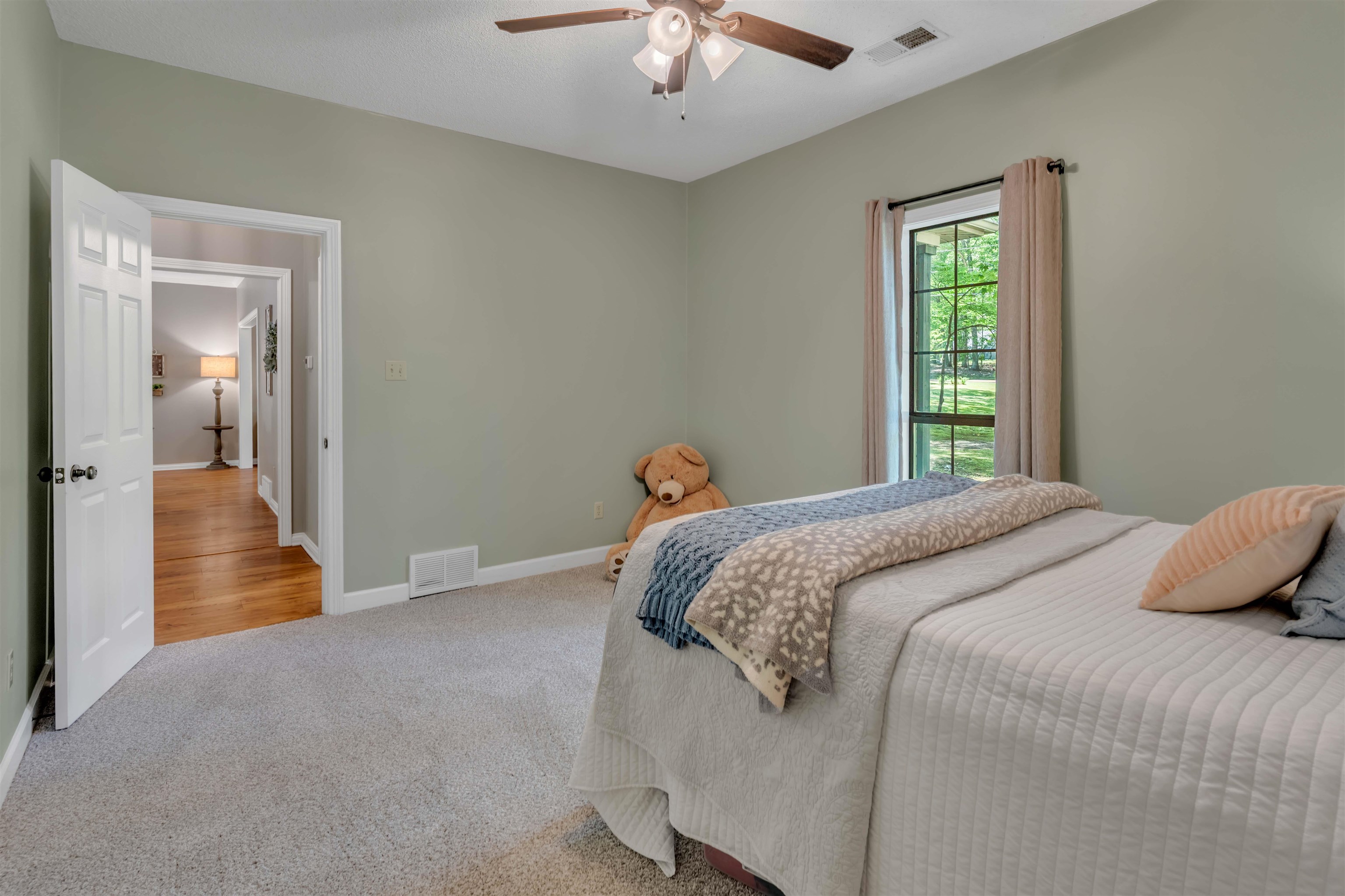 400 Great Oaks Road Eads, TN 38028 - Photo 29 of 40 a bedroom with a bed and a chandelier