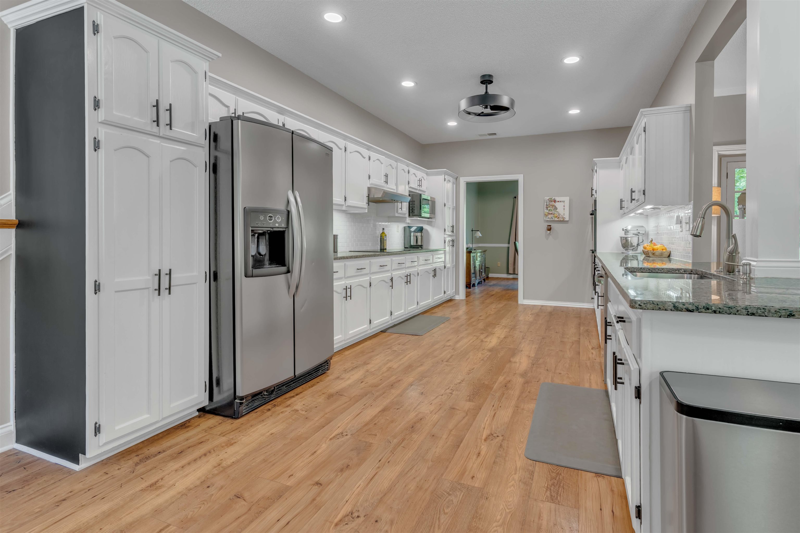 400 Great Oaks Road Eads, TN 38028 - Photo 5 of 40 a large kitchen with stainless steel appliances a refrigerator and a stove top oven