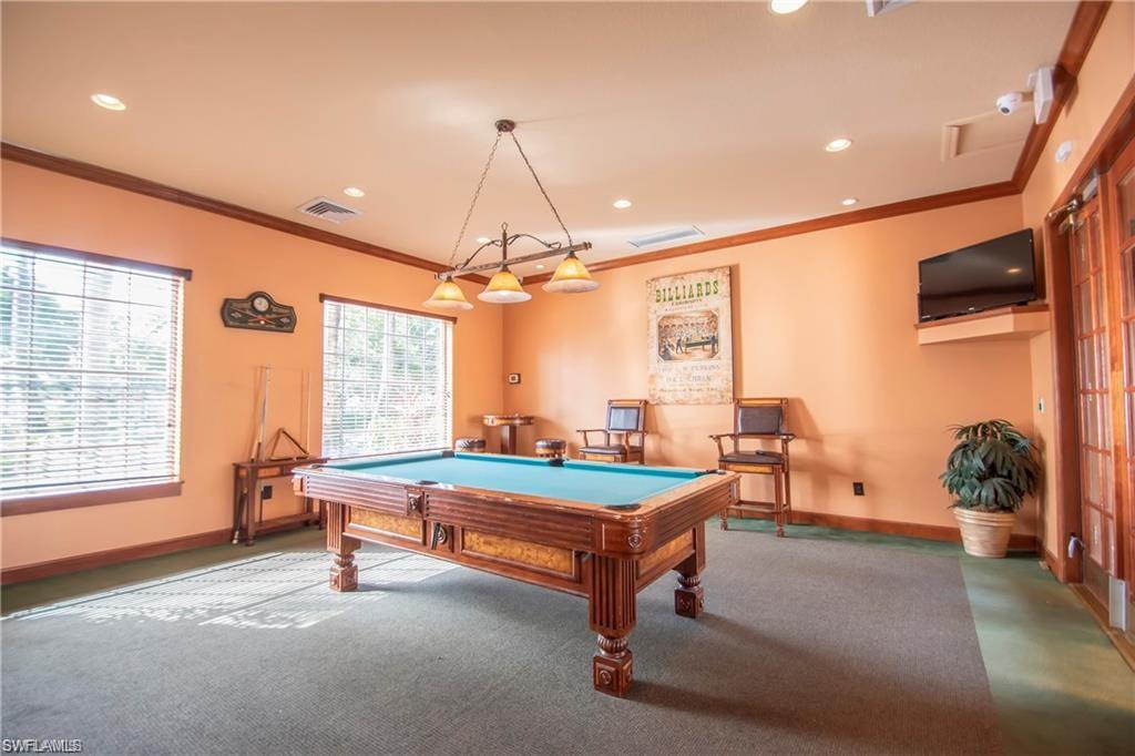 1220 Wildwood Lakes Boulevard, Unit 201 Naples, FL 34104 - Photo 29 of 35 Rec room with carpet floors, ornamental molding, and pool table