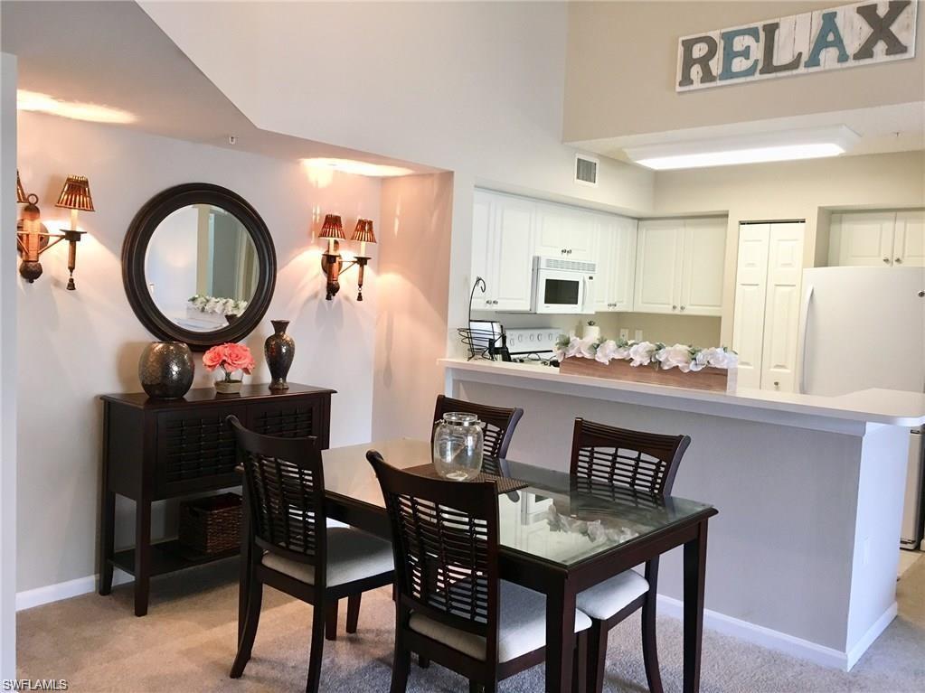 1220 Wildwood Lakes Boulevard, Unit 201 Naples, FL 34104 - Photo 8 of 35 View of carpeted dining room