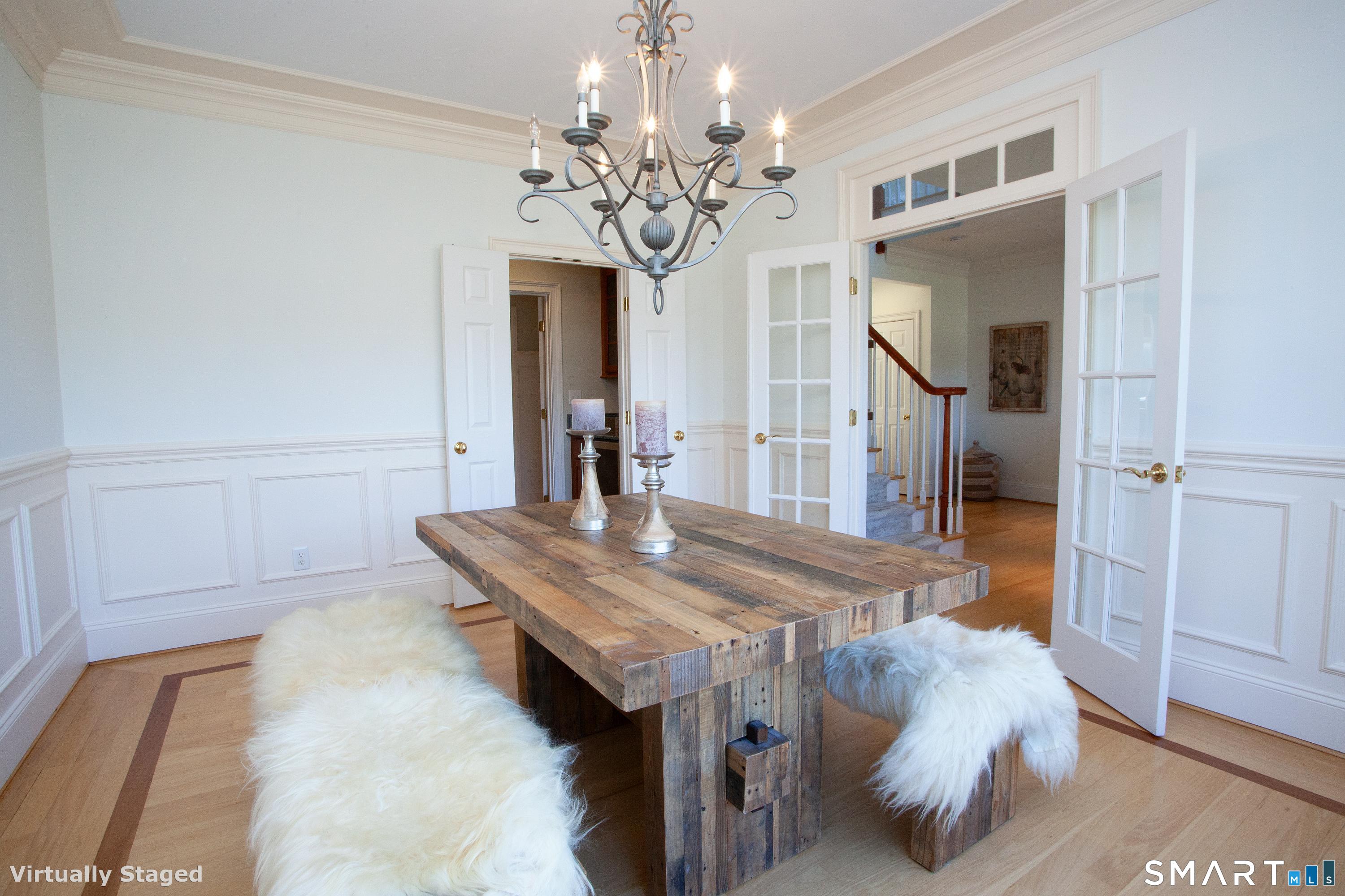 679 Cherry Brook Road Canton, CT 06019 - Photo 38 of 121 a bedroom with a bed and a chandelier