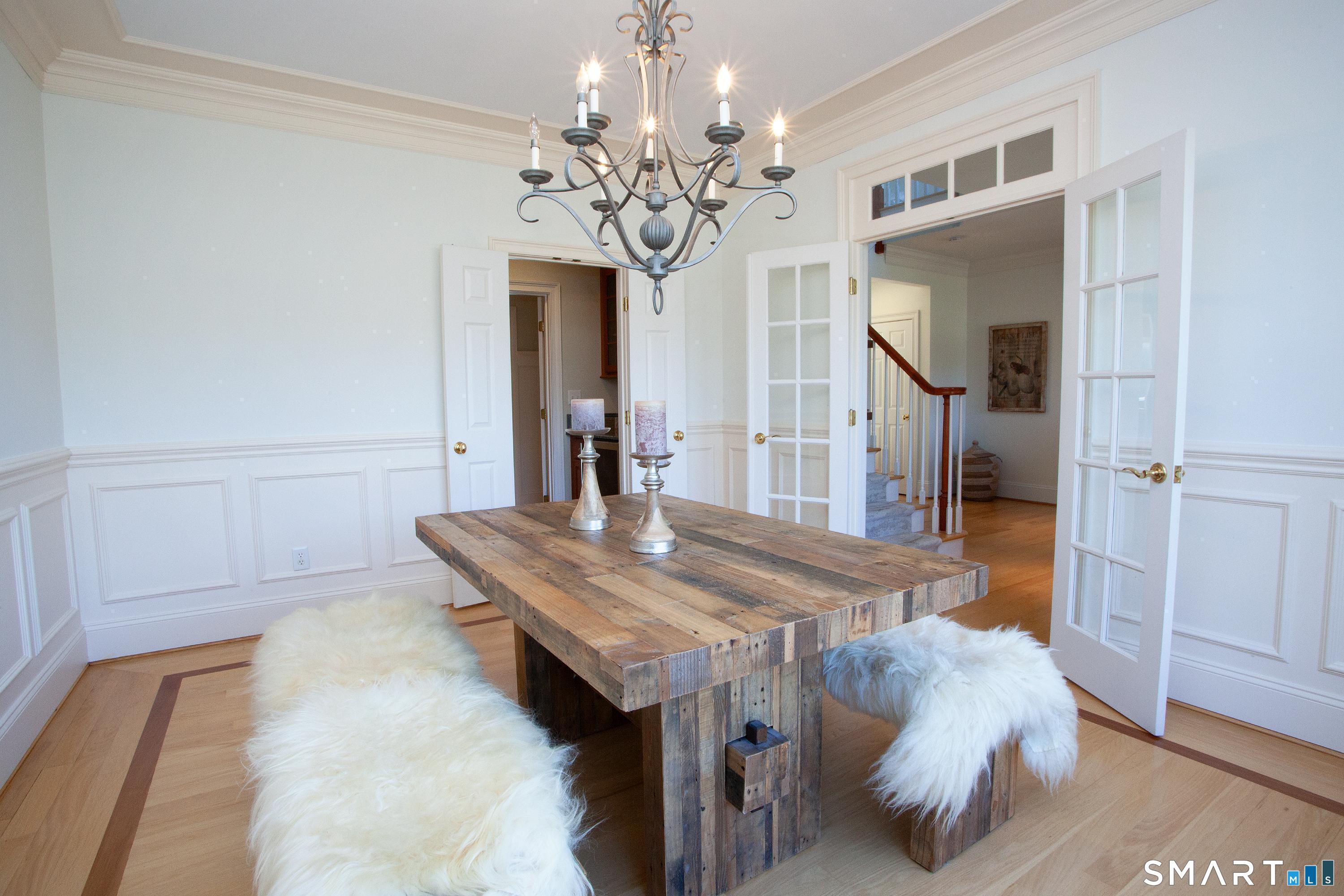 679 Cherry Brook Road Canton, CT 06019 - Photo 39 of 121 a bedroom with a bed and a chandelier