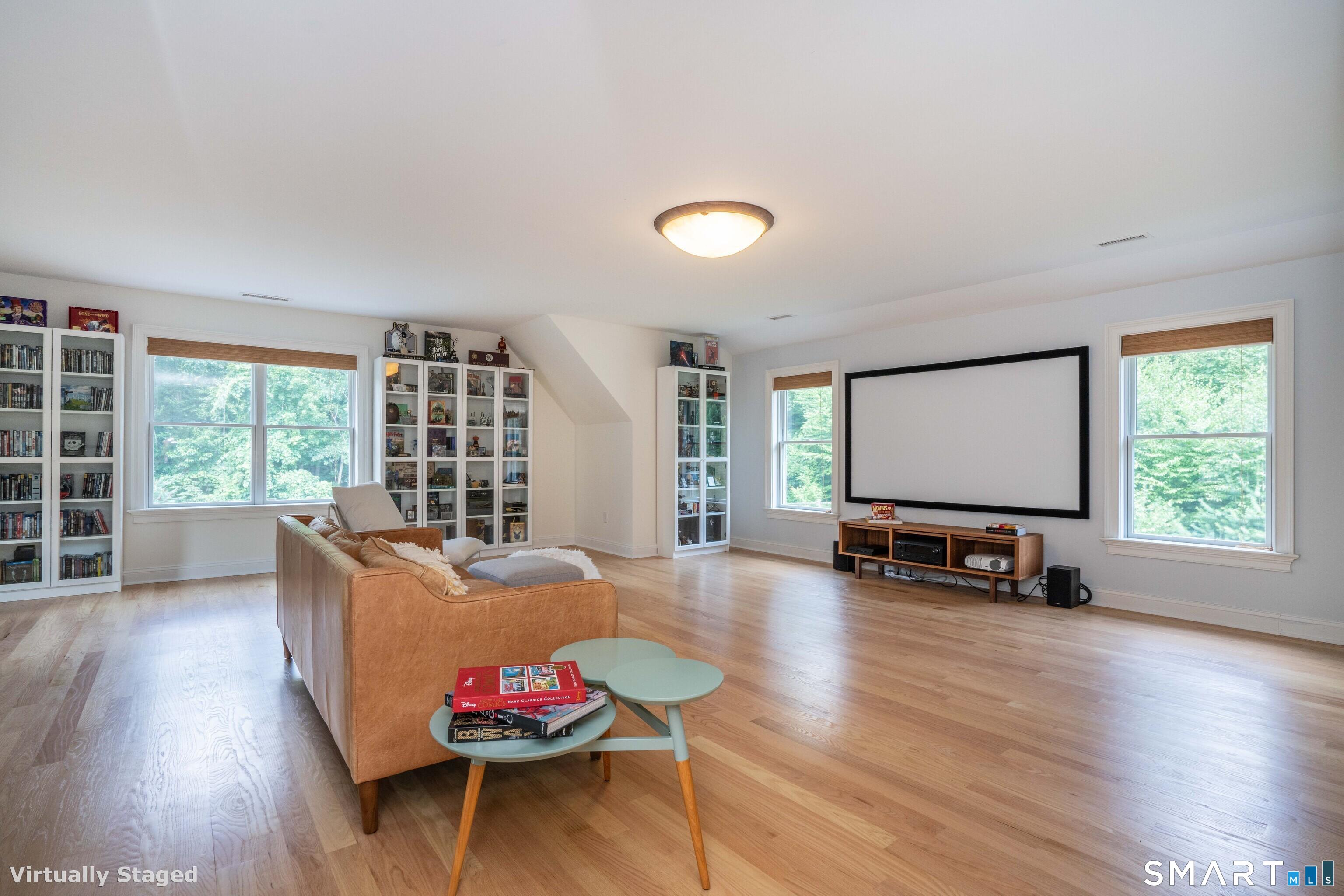 679 Cherry Brook Road Canton, CT 06019 - Photo 80 of 121 a living room with furniture and a wooden floor