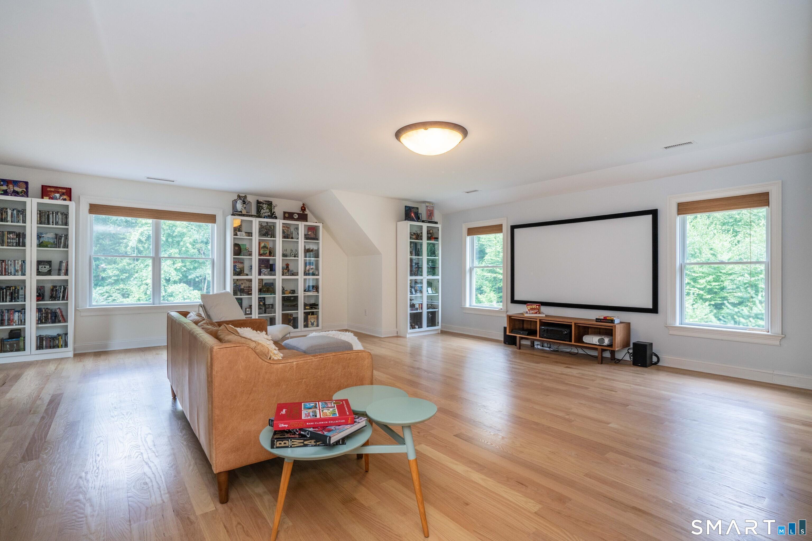 679 Cherry Brook Road Canton, CT 06019 - Photo 81 of 121 a living room with furniture and a wooden floor
