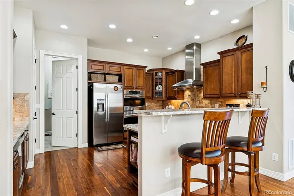 a view of a dining room with furniture and wooden floor
