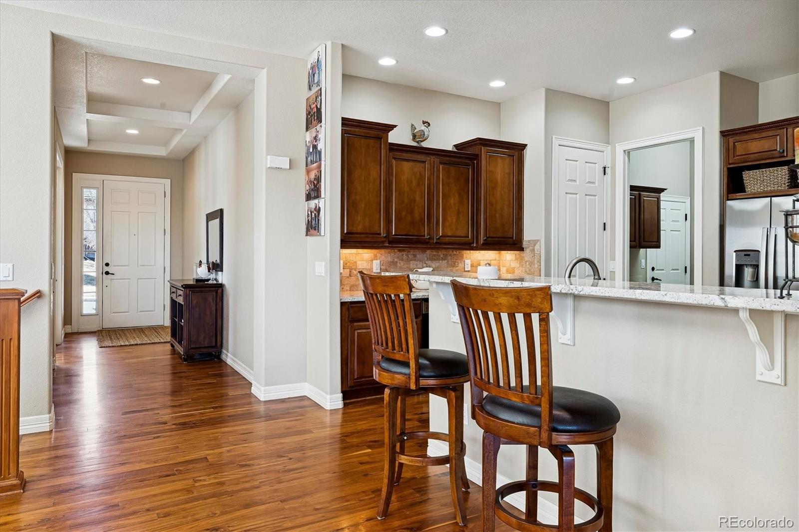 5228 Rialto Drive Parker, CO 80134 - Photo 12 of 50 a view of a dining room with furniture and wooden floor