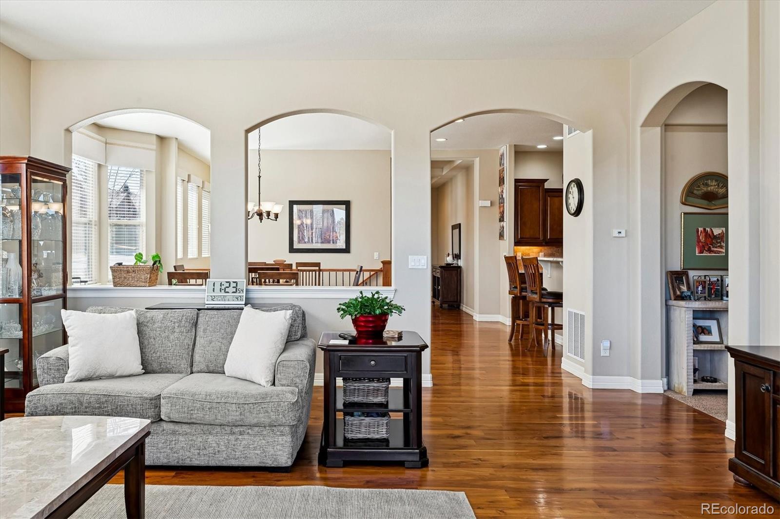 5228 Rialto Drive Parker, CO 80134 - Photo 19 of 50 a living room with furniture and wooden floor
