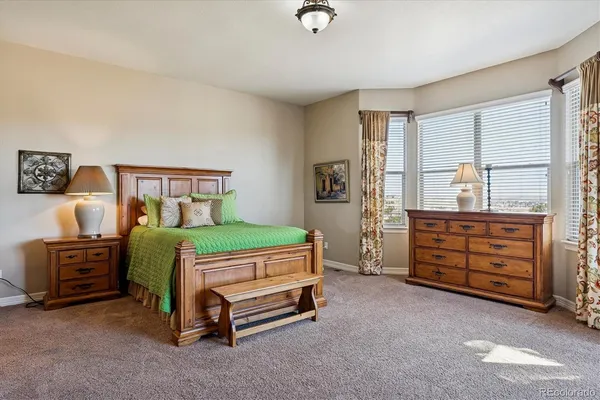 a bedroom with a bed and a tv