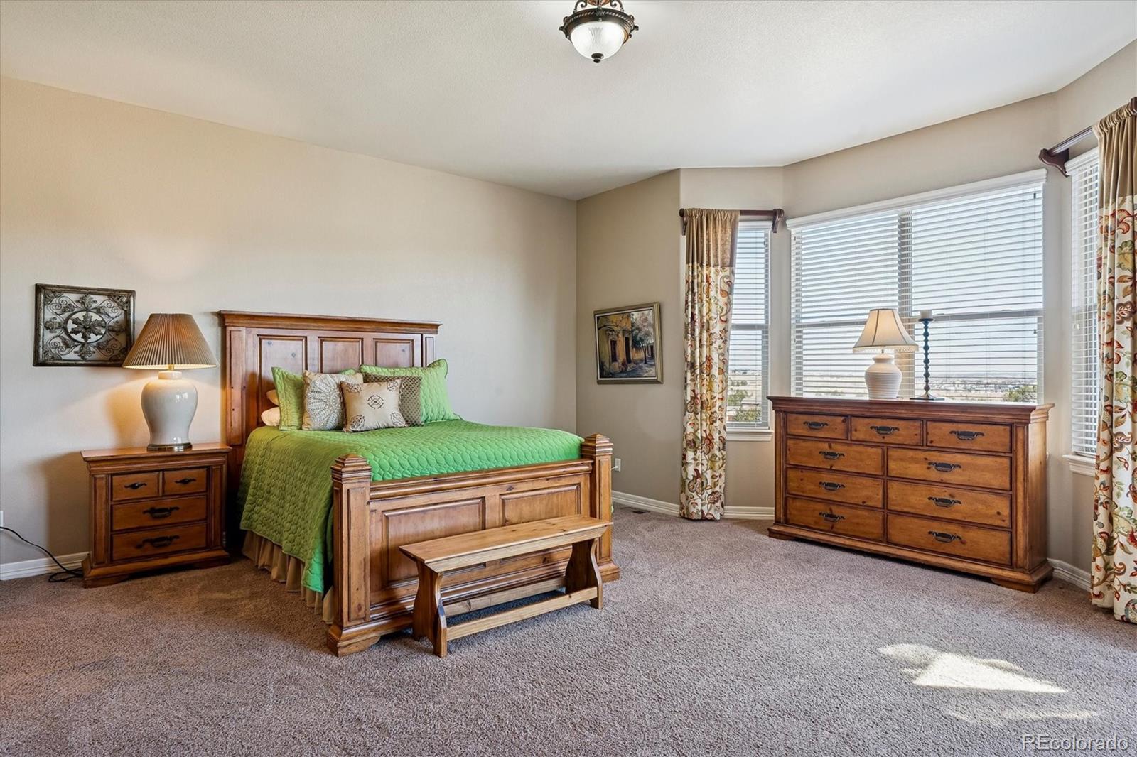 5228 Rialto Drive Parker, CO 80134 - Photo 23 of 50 a bedroom with a bed and furniture