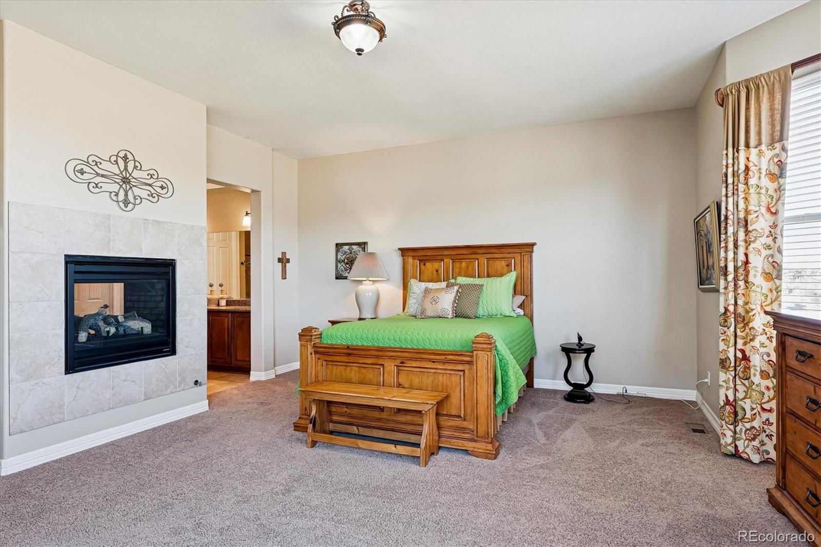 5228 Rialto Drive Parker, CO 80134 - Photo 24 of 50 a bedroom with a bed and a tv