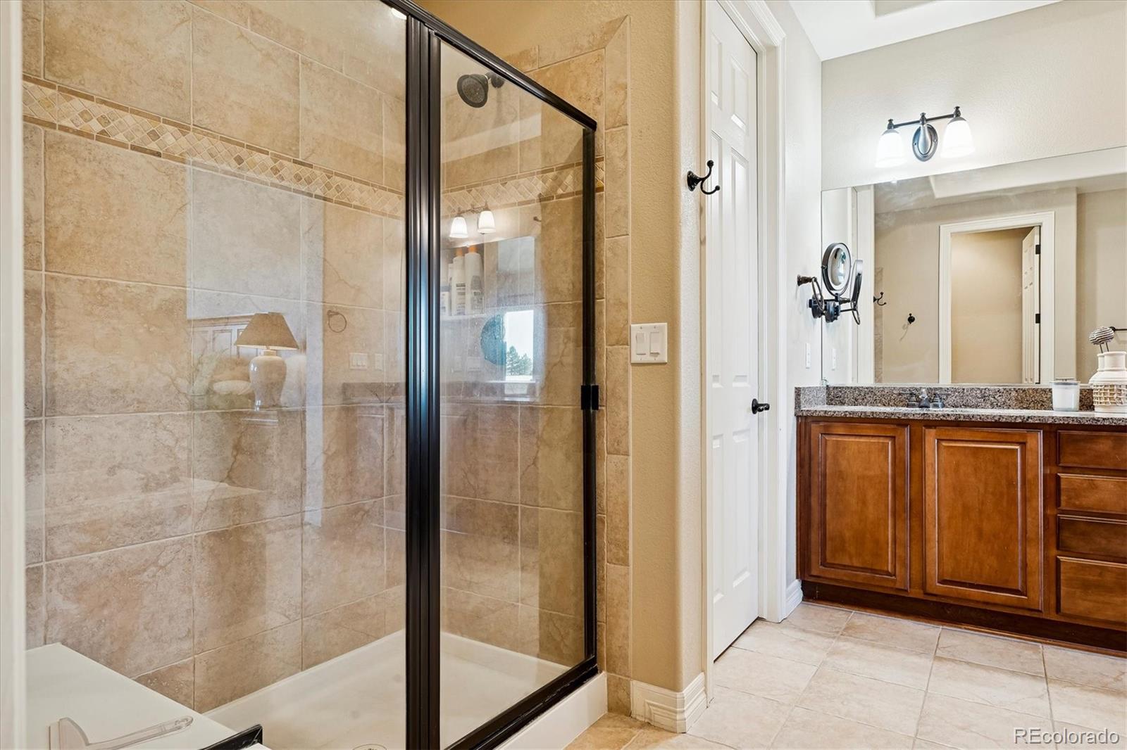 5228 Rialto Drive Parker, CO 80134 - Photo 29 of 50 a bathroom with a shower and a sink