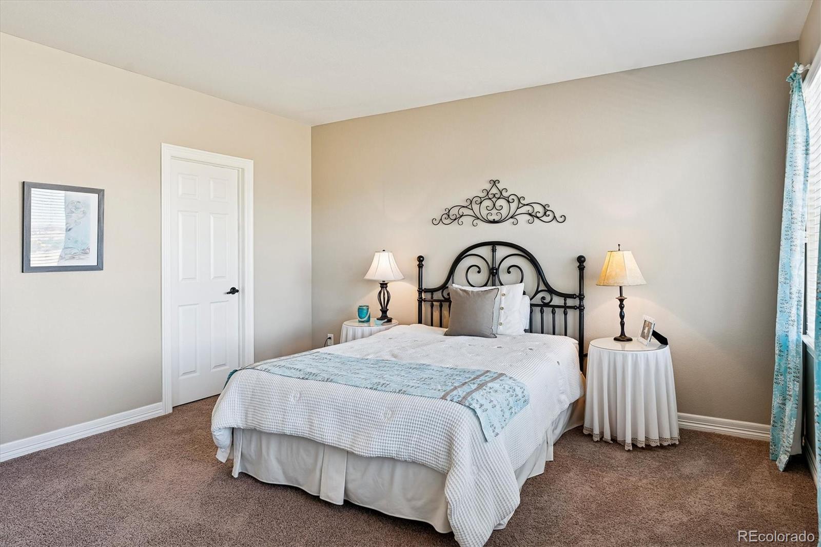 5228 Rialto Drive Parker, CO 80134 - Photo 31 of 50 a bedroom with a bed and a car parked in it