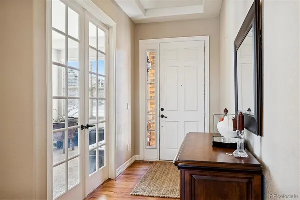 wooden floor and windows in a hall with a window