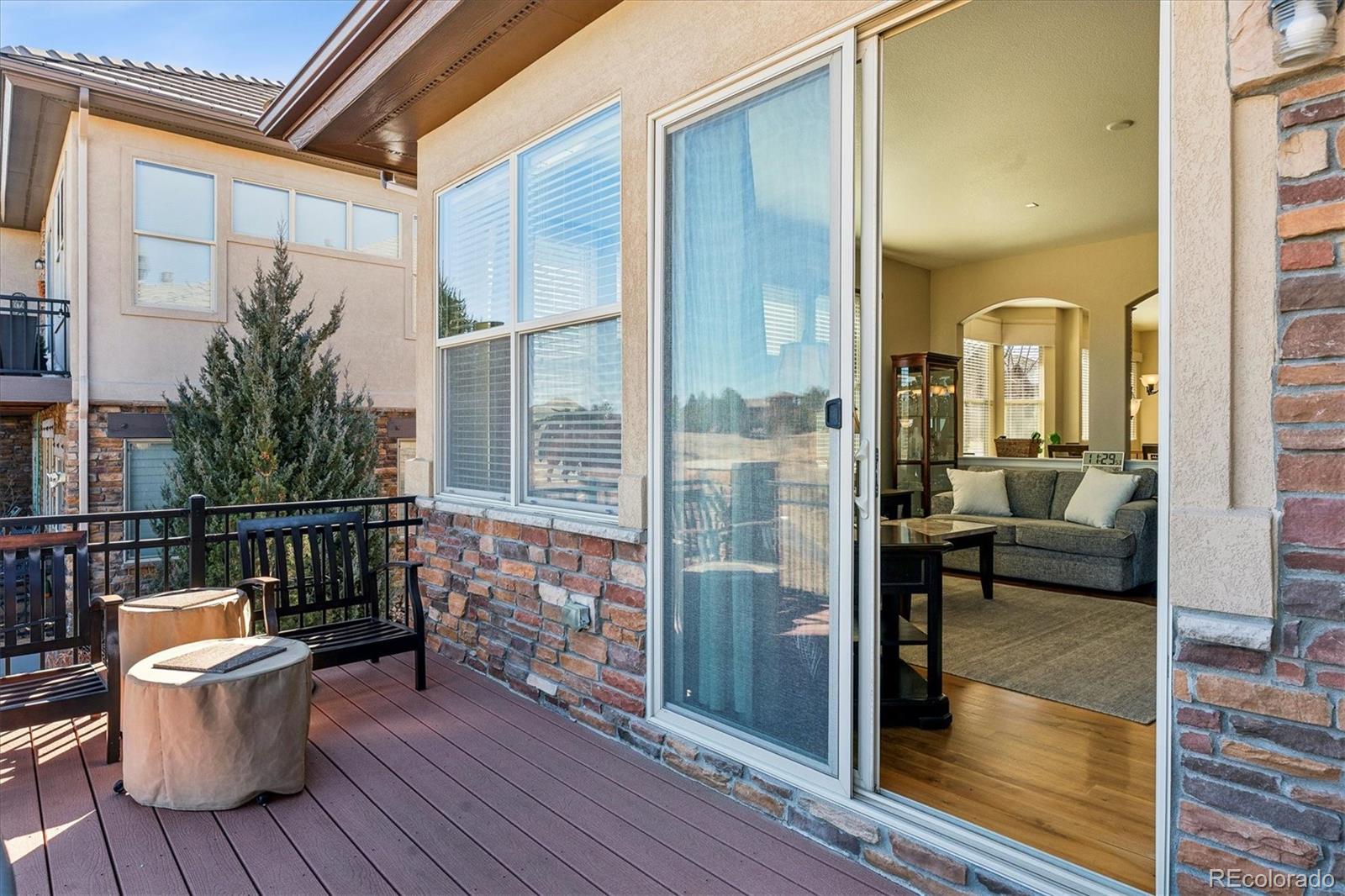 5228 Rialto Drive Parker, CO 80134 - Photo 42 of 50 a balcony with furniture and wooden floor