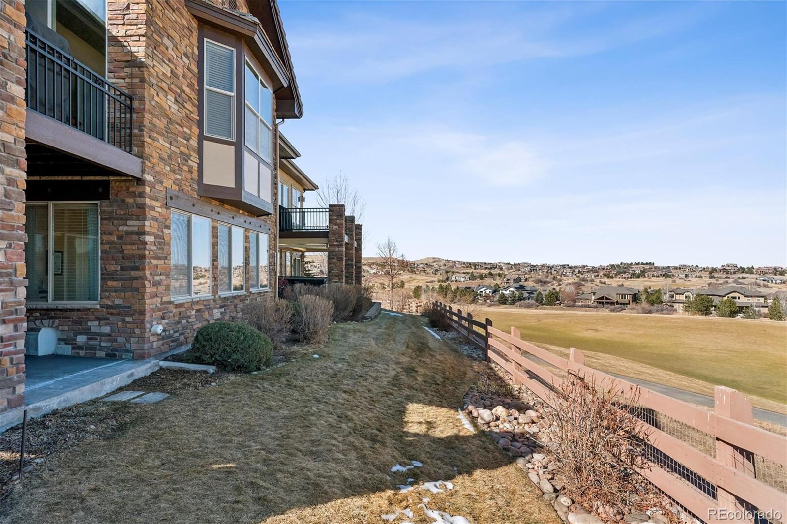 5228 Rialto Drive Parker, CO 80134 - Photo 45 of 50 a view of a lake with a building in the background