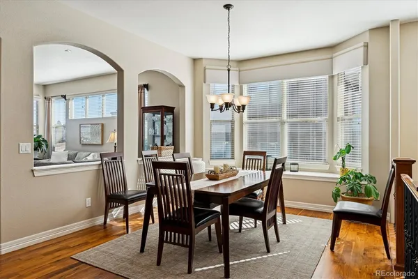 a view of a dining room with furniture window and wooden floor